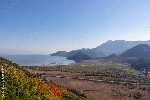 Panoramic view of Lake Skadar National Park in autumn and the tourist village Virpazar, Bar, Montenegro, Balkans, Europe. Travel destination in Dinaric Alps near Albania. Stunning landscape and nature photo