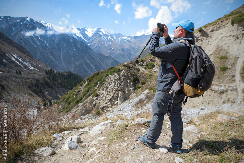 Trekker tourist in the beautiful Ala Archa gorge. Kyrgyzstan