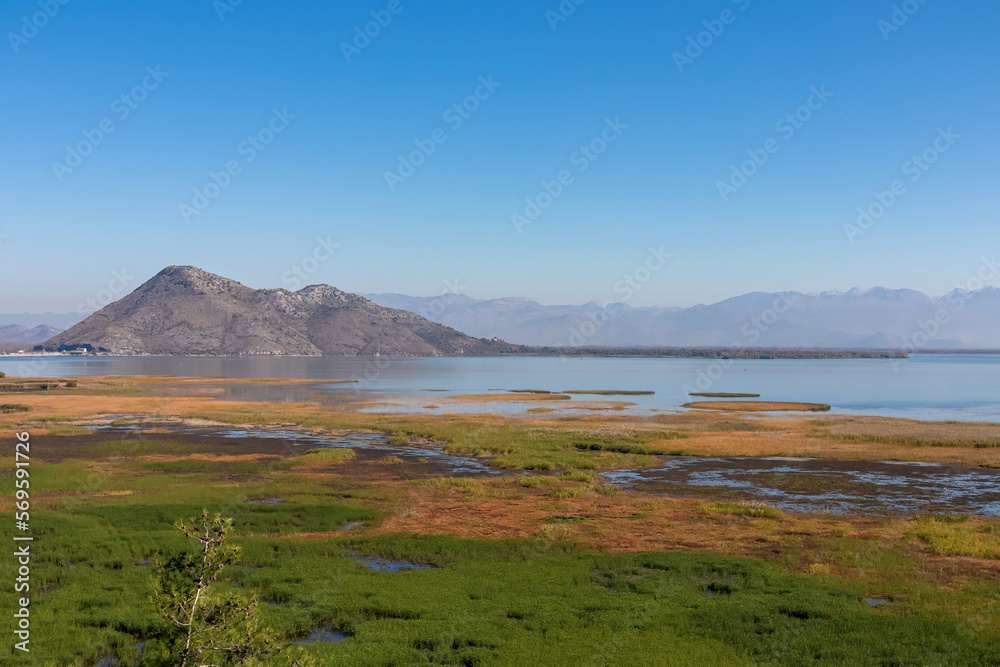 Panoramic view of Lake Skadar National Park in autumn seen from Virpazar, Bar, Montenegro, Balkans, Europe. Travel destination in Dinaric Alps near the Albanian border. Stunning landscape and nature