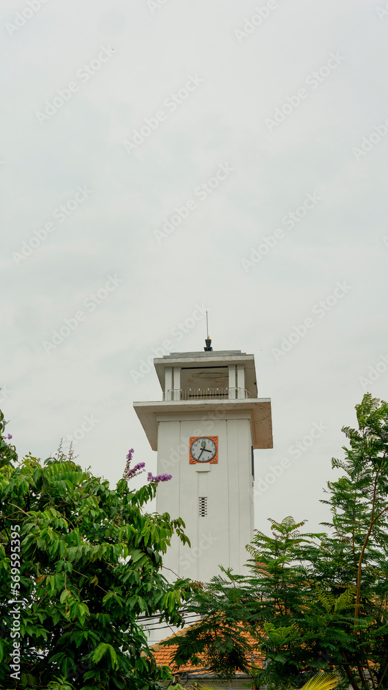 Portrait of the clock monument in the city of Madiun at noon