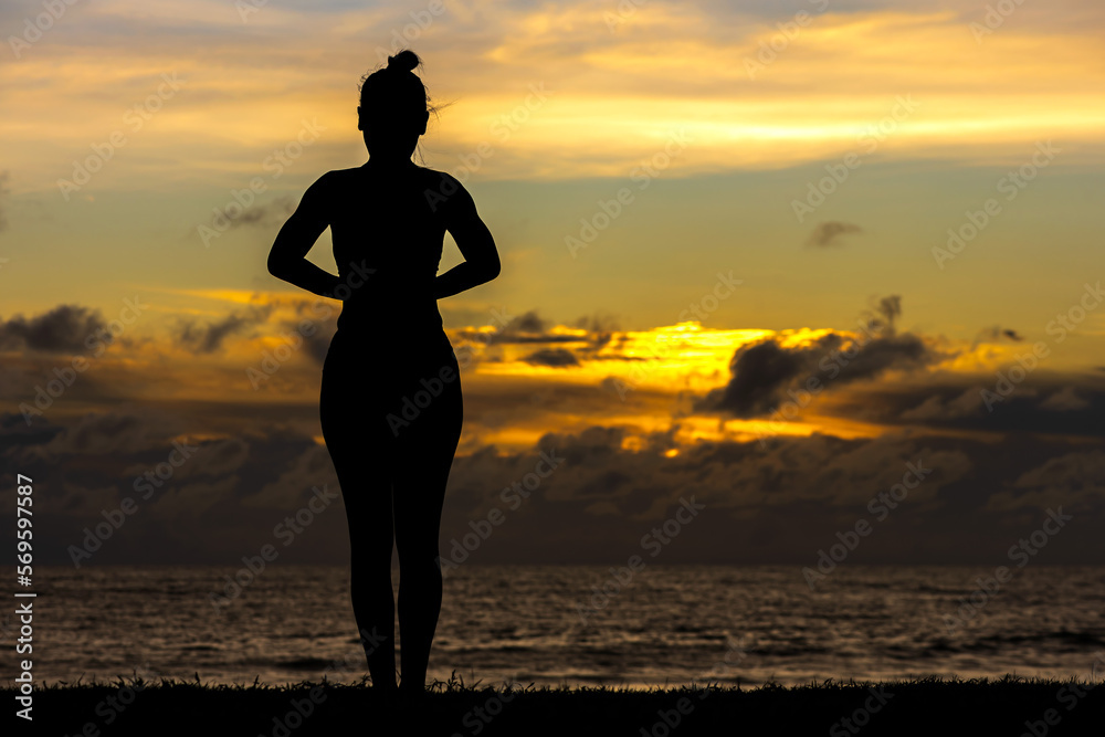 Silhouette sportswoman standing and watching sunset during exercise, 