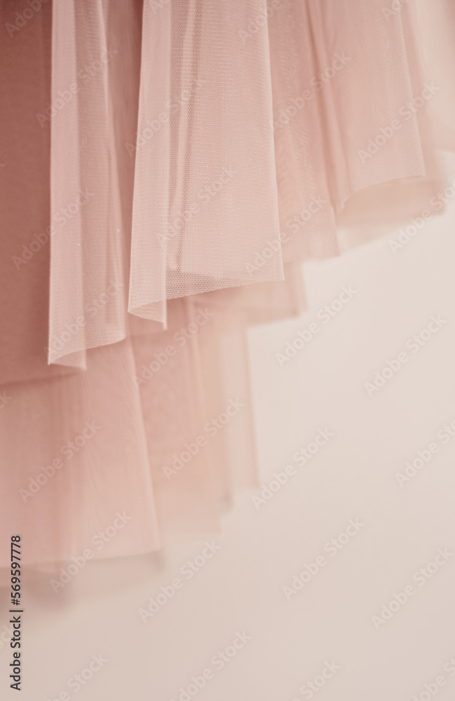 Pastel pink skirt on soft beige background