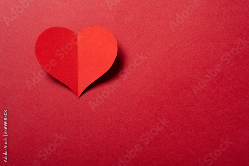 a heart on a red background with copy space