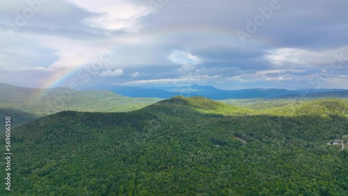 Aerial view of Rainbow over Stinson Lake in White Mountain National Forest in summer in town of Rumney, Grafton County, New Hampshire NH, USA.  photo