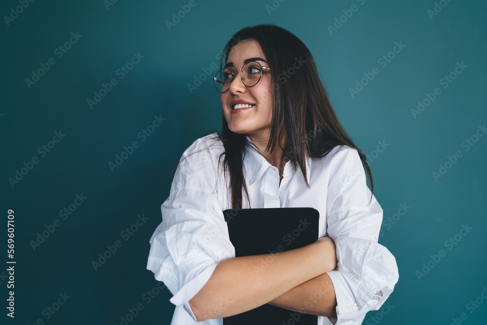 Dreamy young female employee with tablet Dreamy young female employee with tablet
