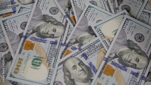 Wallpaper Mural Close-up of a lot of hundred-dollar bills slowly rotating. Financial concept. Background of US dollar bills. Torontodigital.ca