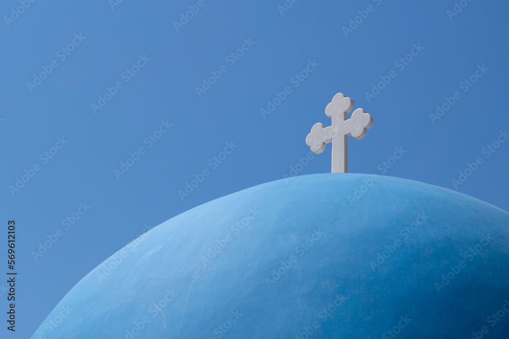 The blue dome of Church of Agios Nikolaos in Oia, overlooking the caldera, Santorini, The Cyclades, Aegean Sea, Greek Islands, Greece, Europe The blue dome of Church of Agios Nikolaos in Oia, overlooking the caldera, Santorini, The Cyclades, Aegean Sea, Greek Islands, Greece, Europe