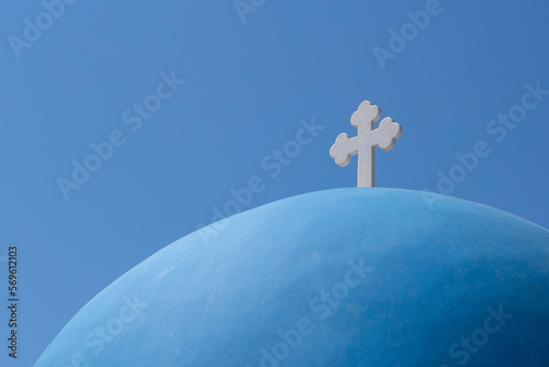 The blue dome of Church of Agios Nikolaos in Oia, overlooking the caldera, Santorini, The Cyclades, Aegean Sea, Greek Islands, Greece, Europe photo
