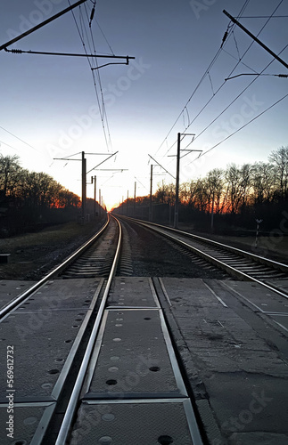 The railroad goes into the distance. Sunset, evening sky.