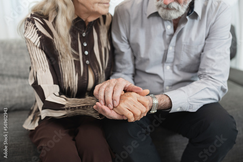 Hand touch couple caucasian older at home