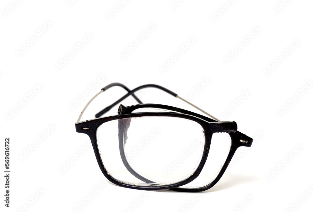 Broken reading glasses on white background Broken reading glasses on white background
