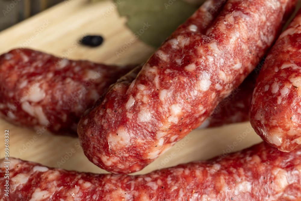 Dried veal sausage during slicing Dried veal sausage during slicing