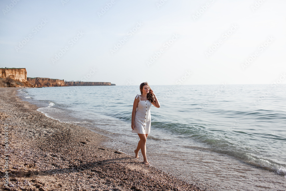 Portrait of a woman walks in the beach