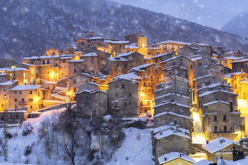 The illuminated medieval village of Scanno under snowfall, Abruzzo National Park, L'Aquila province, Abruzzo, Italy, Europe photo