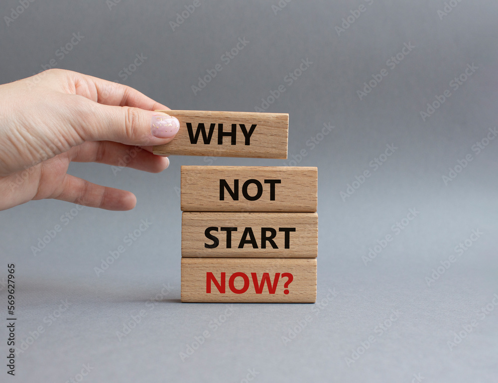 Why not start now symbol. Concept words Why not start now on wooden blocks. Beautiful grey background. Businessman hand. Business and Why not start now concept. Copy space. Why not start now symbol. Concept words Why not start now on wooden blocks. Beautiful grey background. Businessman hand. Business and Why not start now concept. Copy space.