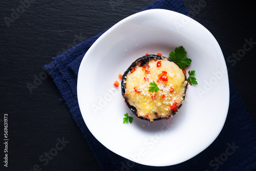 Healthy food concept bake Cheese Stuffed Mushrooms on black background with copy space photo