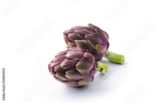 Artichoke flower, two purple edible bud isolated on white background. Food concept.