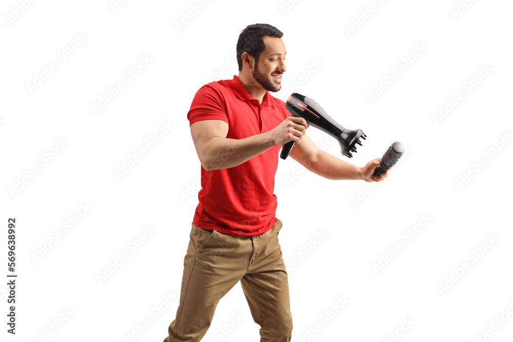 Man working with a hair dryer and a brush Man working with a hair dryer and a brush