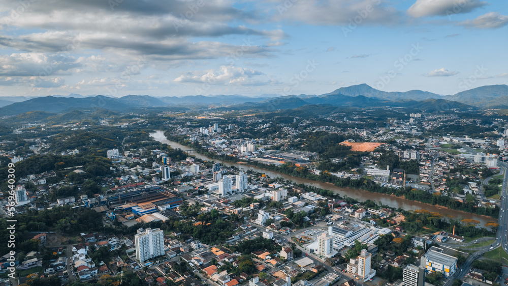 aerial image of downtown Blumenau, with Itajaí Açú River, Santa Catarina, southern Brazil, buildings, main streets, vegetation and sunny day