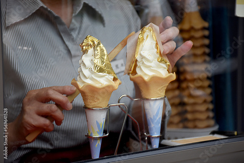 Tableau sur toile Vanilla soft ice cream on a cone with a thin leaf of gold famous in Kanagawa city, Japan