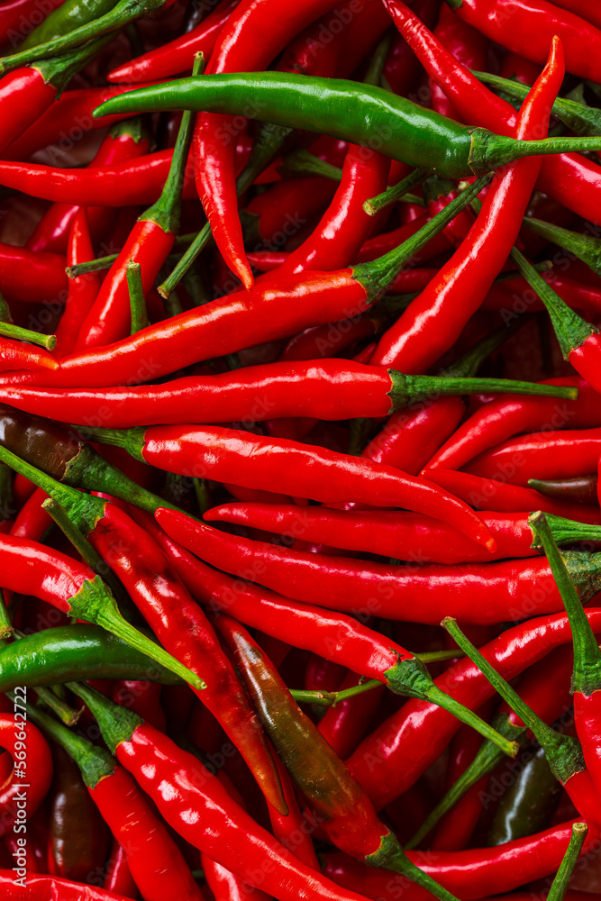macro red pepper,Red hot chilli peppers pattern texture background. Close up. Landscape. A backdrop ofRed hot chilli peppers. Street vegetable market. Group of Red hot chilli peppers