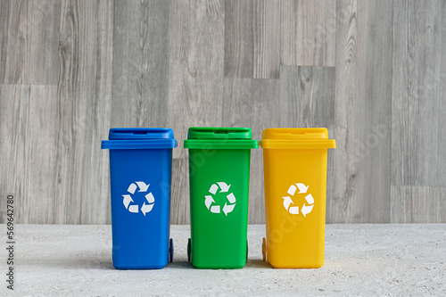 Blue, green and yellow container for separate garbage collection, waste recycling concept