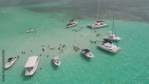 Canvas Print Aerial view of yachts and tour boats in sting ray city in Cayman Islands in shal