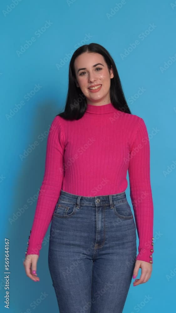 Smiling young woman smiling and looking at camera. Vertical Video. Smiling young woman smiling and looking at camera. Vertical Video.