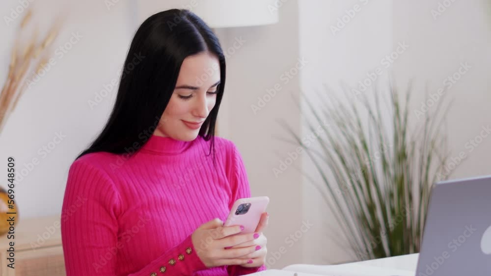 Focused woman using smartphone and laptop Focused woman using smartphone and laptop