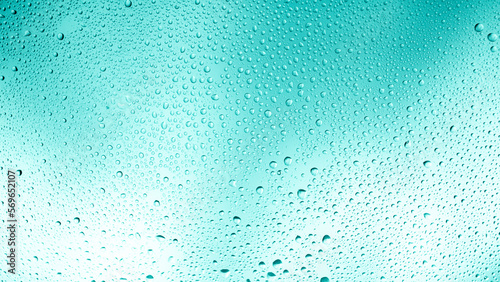 Glowing gradient turquoise background with contrasting water drops