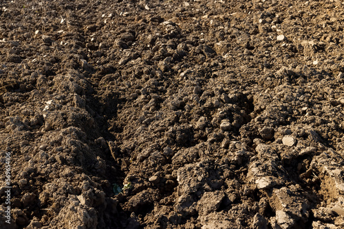 Processed plowed fertile soil in the field © rsooll