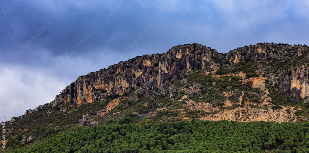 Rocky Mountain by the Sea Coast. Cloudy Sky. Sardinia, Italy. Nature Background Rocky Mountain by the Sea Coast. Cloudy Sky. Sardinia, Italy. Nature Background