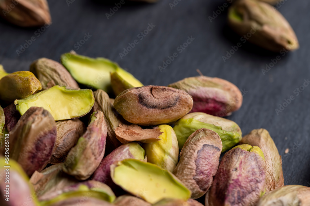 Crispy delicious pistachios with salt on the table Crispy delicious pistachios with salt on the table