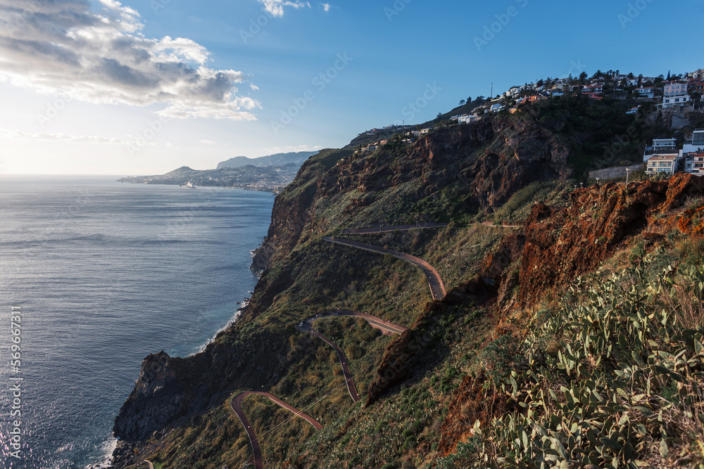 Beautiful mountain with a serpentine road near the ocean in Madeira island