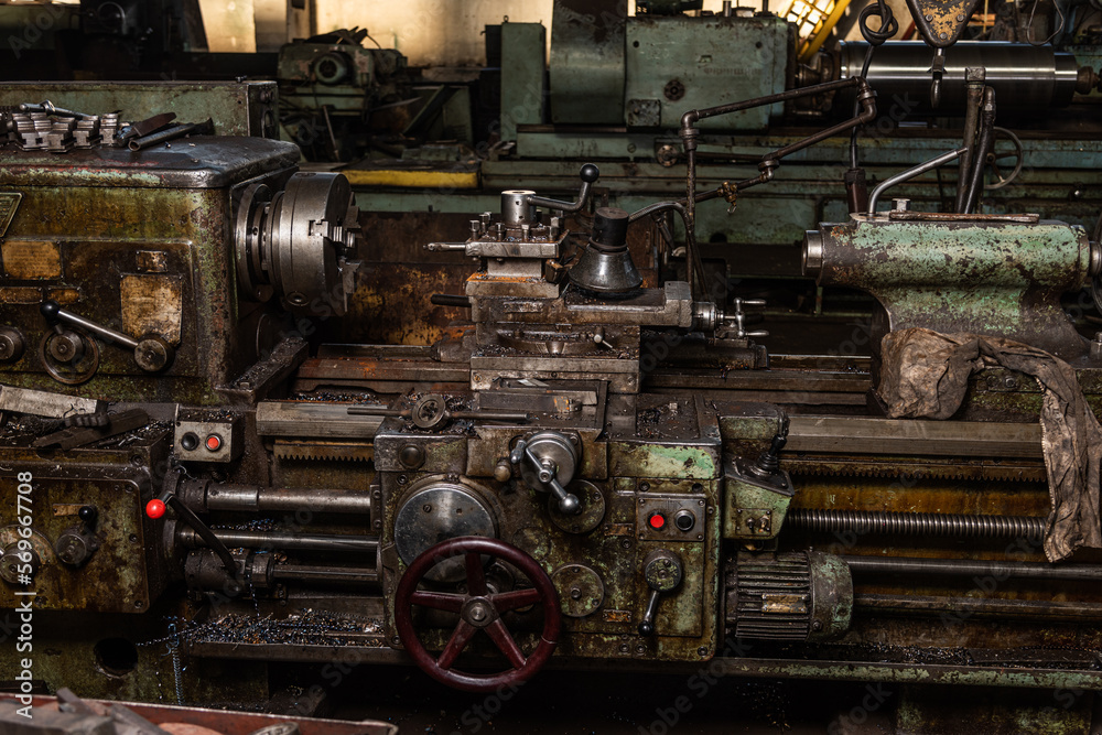 Old equipment, machines, tools in an abandoned mechanical factory