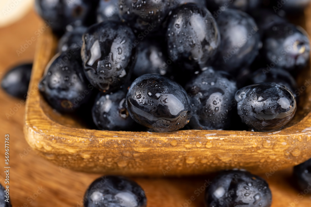 sweet ripe black grapes covered with drops of water sweet ripe black grapes covered with drops of water
