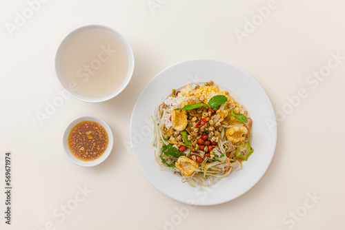 Com hen Hoi An, Vietnamese rice dish with baby basket clams rice, Vietnamese food isolated on white background; top view