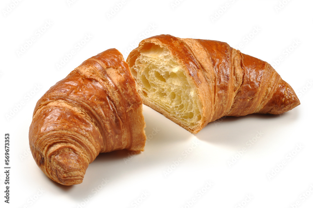 Empty croissant cut in half on a white background