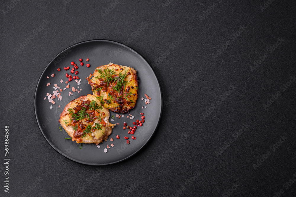 Meat baked in the oven with pineapple, tomatoes, cheese, spices and herbs Meat baked in the oven with pineapple, tomatoes, cheese, spices and herbs