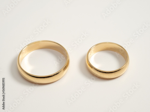 Wedding rings on a light background. Gold rings. Close-up.