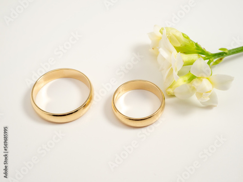 Wedding rings on a light background. Gold rings. Close-up.