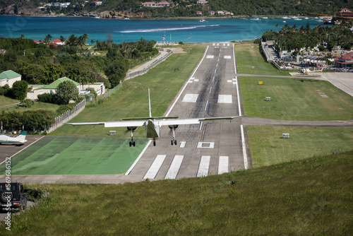 Aircraft landing on the runway at Rémy de Haenen Airport on the French Caribbean island of St Barth (Saint Barthelemy) photo