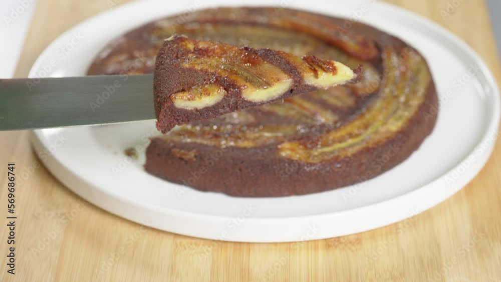 Pour the cocoa chocolate mixture into the hot pan with fried bananas to make the cake. High quality 4k footage Pour the cocoa chocolate mixture into the hot pan with fried bananas to make the cake. High quality 4k footage