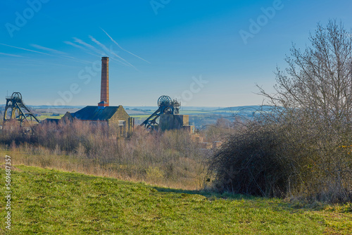 Landscape image in a rural area with a old coal mine in view. photo
