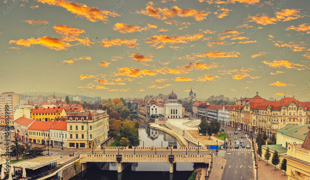 Discover the beauty of Oradea, Romania with this stunning cityscape photo. The towering buildings and bustling city center create a dynamic scene that is perfect for businesses and tourism industries