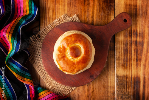 Bisquet. Also known as Bisquets Chinos, it is one of the traditional breads in Mexico, commonly consumed hot, cut in half and spread with butter and fruit jam. photo