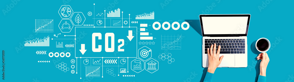 Reduce CO2 theme with person using a laptop computer Reduce CO2 theme with person using a laptop computer