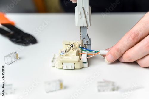 installing a network cable into a prefabricated RJ45 module using the LSA punch down tool, ethernet socket photo