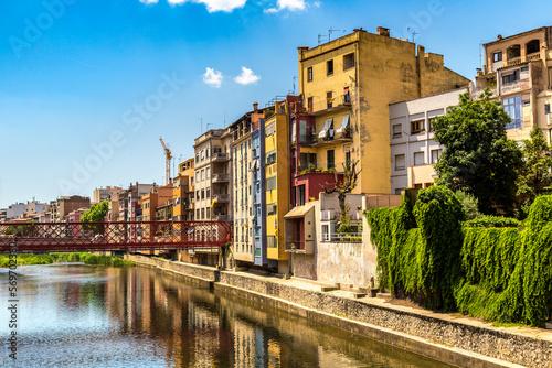 Colorful houses and Eiffel bridge in Girona photo