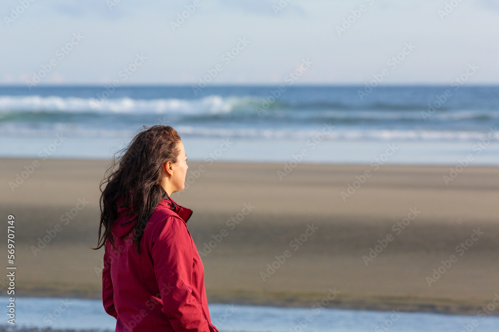 portrait single women stand and enjoy a magnificent beach at vancouver island portrait single women stand and enjoy a magnificent beach at vancouver island